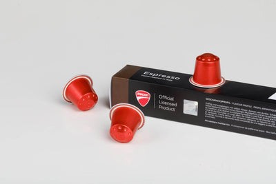 Espresso by Ducati box close-up, Official Licensed Product, with red Nespresso® Original compatible capsules